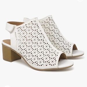 Women's Elect Caged Geometric Laser Cut Out Peep toe in good used condition.